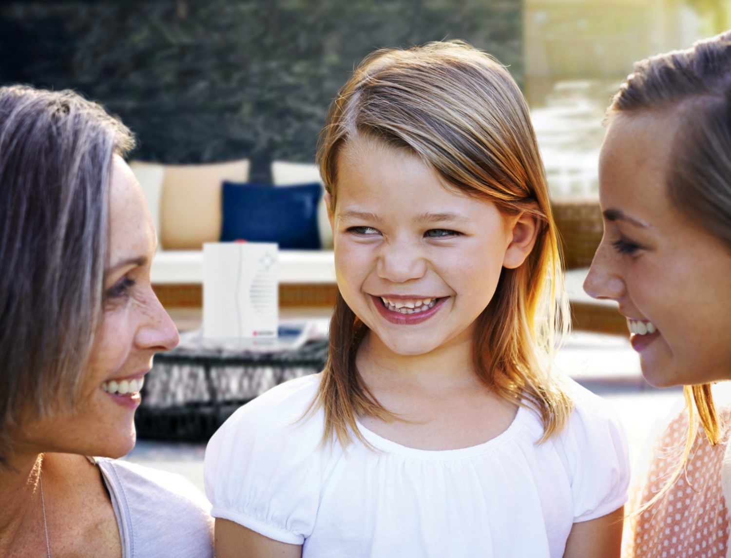 Family with Bellman Visit Portable Receiver on the Table